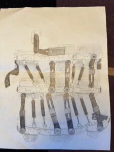 pencil drawing on white paper of a Whisper brace, showing the metal rods, foam pads, and plastic pieces that all go together to make the brace