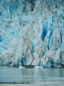 Close-up section of a glacier in Alaska. It looks very blue.